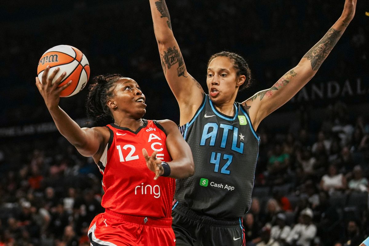Las Vegas Aces guard Chelsea Gray (12) eyes the basket while guarded by Atlanta Dream Brittney Griner (42) during WNBA game against Atlanta Dream on Tuesday July 22 ,2025 in Las Vegas.  
