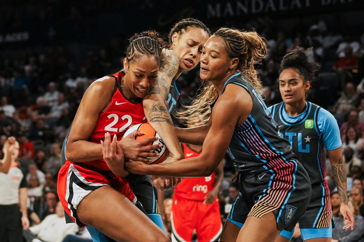 Las Vegas Aces center A’ja Wilson (22) ,Atlanta Dream Brittney Griner (42) and forward Naz Hilmon (0) try to gain control of the ball during WNBA game against Atlanta Dream on Tuesday July 22 ,2025 in Las Vegas.  