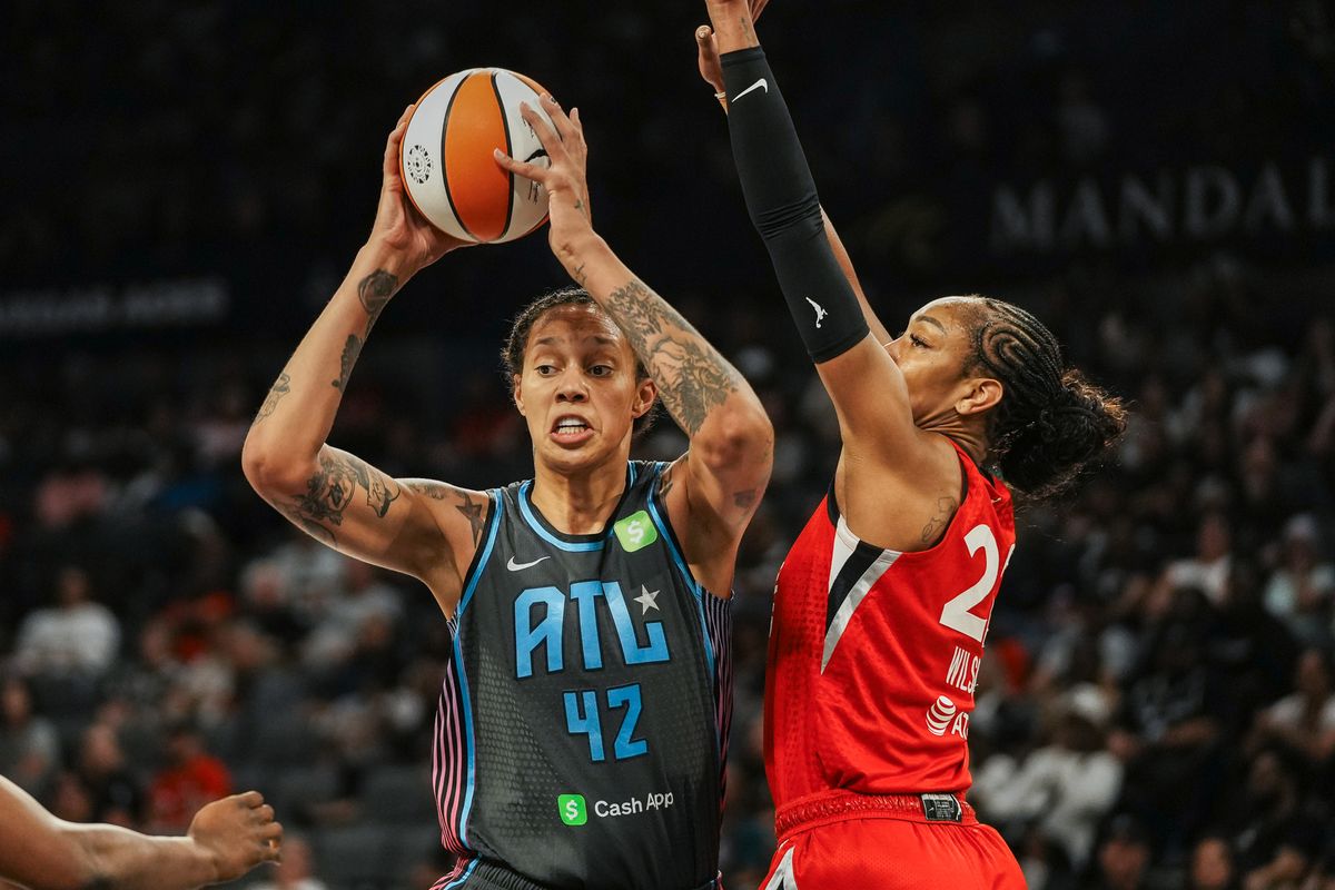 Atlanta Dream center Brittney Griner (42) prepares to pass the ball to a teammate while guarded by Las Vegas Aces A’ja Wilson (22) during WNBA game against Las Vegas Aces on Tuesday July 22 ,2025 in Las Vegas. 