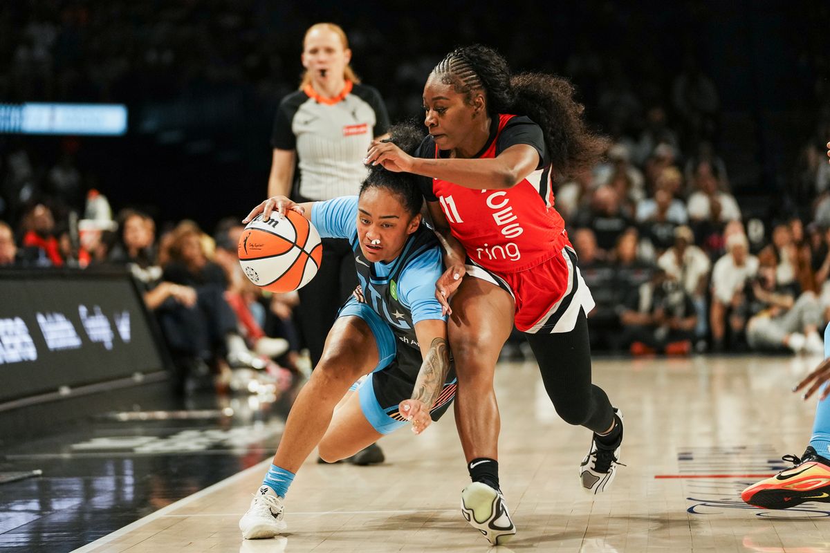 Atlanta Dream guard Te-Hina Paopao (2) attempts to take the ball down the court while guarded by Las Vegas Aces guard Dana Evans (11) during WNBA game against Las Vegas Aces on Tuesday July 22 ,2025 in Las Vegas. 