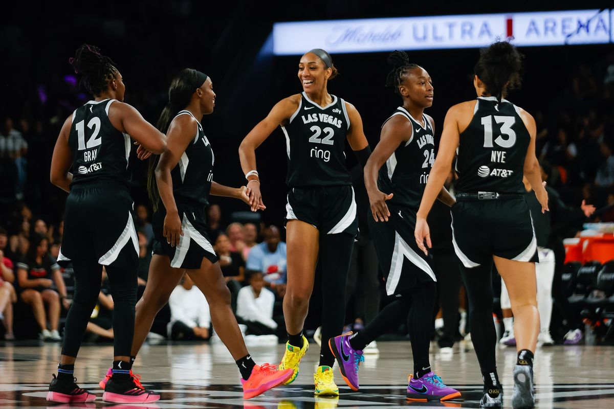 Las Vegas Aces high-five each other after a scoring run during a WNBA game between the Las Vegas Aces and the Golden State Valkyries, Sunday August 3, 2025 in Las Vegas, Nev.