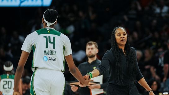 Seattle Storm coach Noelle Quinn high fives center Dominique Malonga (14) during the first half of WNBA game against Las Vegas Aces Friday August 8, 2025 in Las Vegas.  