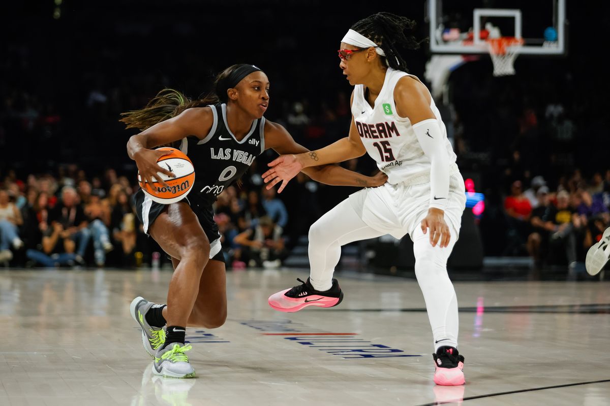 Las Vegas Aces guard Jackie Young (0) looks to drive to the basket as Atlanta Dream guard Allisha Gray (15) guards her during a WNBA game between the Las Vegas Aces and the Atlanta Dream, Tuesday August 19, 2025 in Las Vegas, Nev. Las Vegas Aces guard Jackie Young (0) looks to drive to the basket as Atlanta Dream guard Allisha Gray (15) guards her during a WNBA game between the Las Vegas Aces and the Atlanta Dream, Tuesday August 19, 2025 in Las Vegas, Nev.