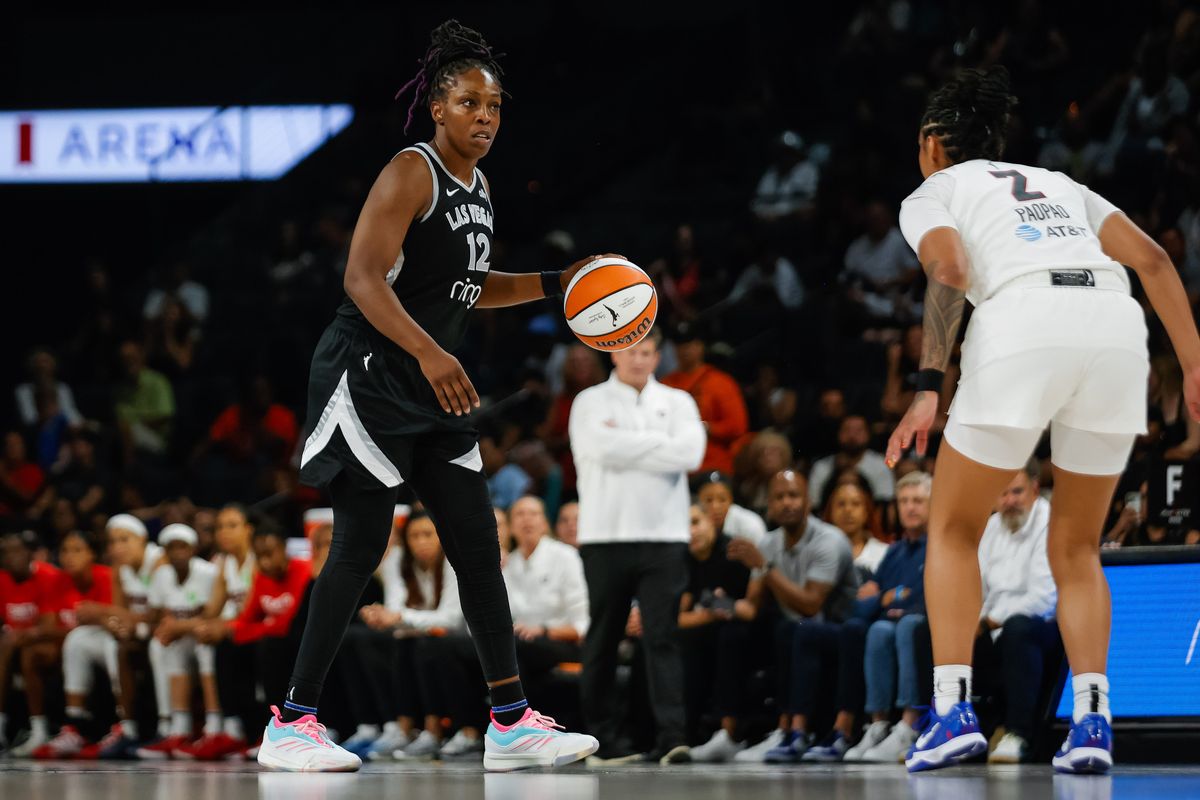Las Vegas Aces guard Chelsea Gray (12) scans the court while dribbling the ball during a WNBA game between the Las Vegas Aces and the Atlanta Dream, Tuesday August 19, 2025 in Las Vegas, Nev. Las Vegas Aces guard Chelsea Gray (12) scans the court while dribbling the ball during a WNBA game between the Las Vegas Aces and the Atlanta Dream, Tuesday August 19, 2025 in Las Vegas, Nev.