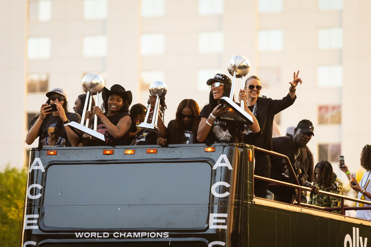 Las Vegas Aces forward NaLyssa Smith (Left), guard Jackie Young (Middle), and forward A’ja Wilson (Right) hoists the Aces’ WNBA championship trophies during the Aces’ championship parade, Friday October 17, 2025 in Las Vegas, Nev. Las Vegas Aces forward NaLyssa Smith (Left), guard Jackie Young (Middle), and forward A’ja Wilson (Right) hoists the Aces’ WNBA championship trophies during the Aces’ championship parade, Friday October 17, 2025 in Las Vegas, Nev.