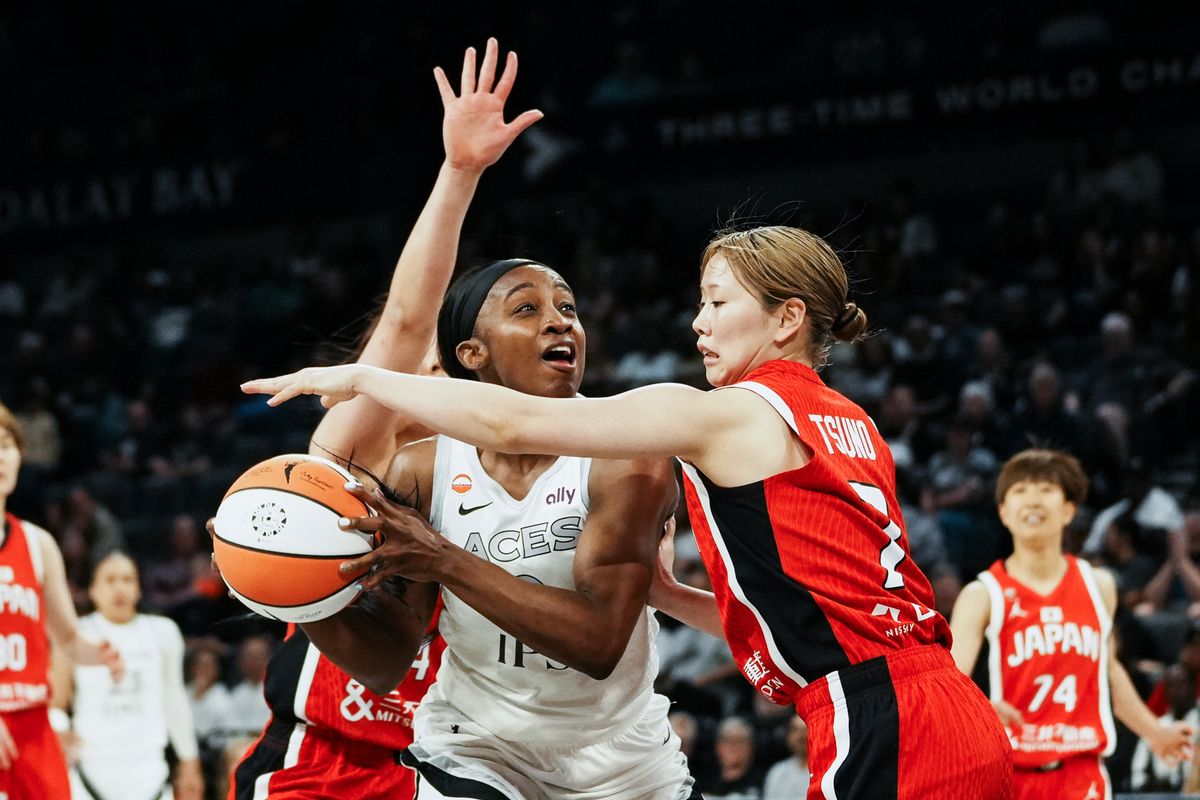 Las Vegas Aces guard Jackie Young (0) eyes the basket while guarded by Japan Nanami Tsuno (7) during first half of WNBA preseason game on Sunday April 26, 2026 at Michelob Ultra Arena in Las Vegas.