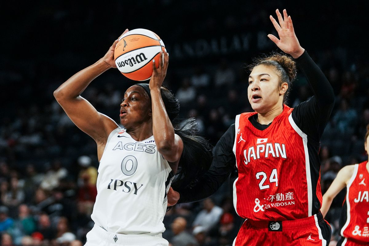 Las Vegas Aces guard Jackie Young (0) scans the court while  guarded by Japan center Kadysha Juna Umezawa (24) during first half of WNBA preseason game against Japan on Sunday April 26, 2026 at Michelob Ultra Arena in Las Vegas.