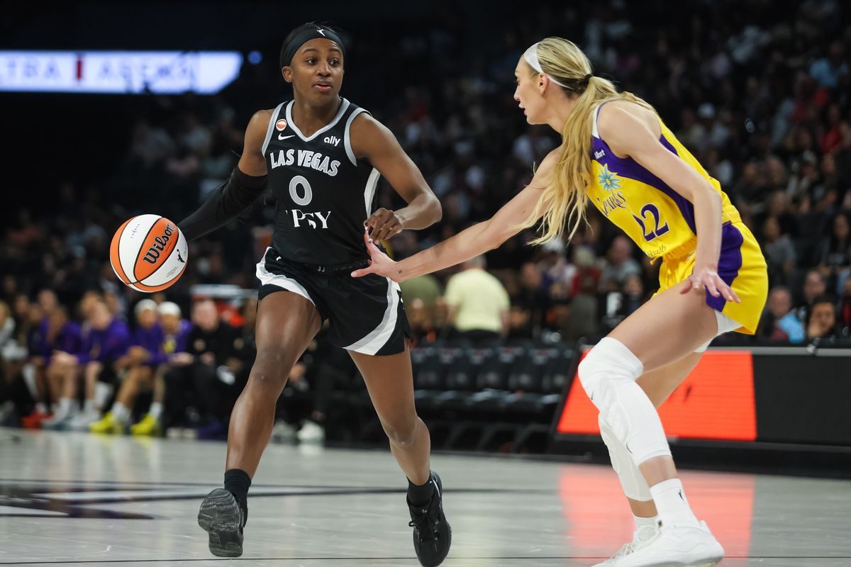 Las Vegas Aces guard Jackie Young (0) dribbles the ball during a WNBA game between the Las Vegas Aces and the Los Angeles Sparks, Saturday May 23, 2026 in Las Vegas, Nev.