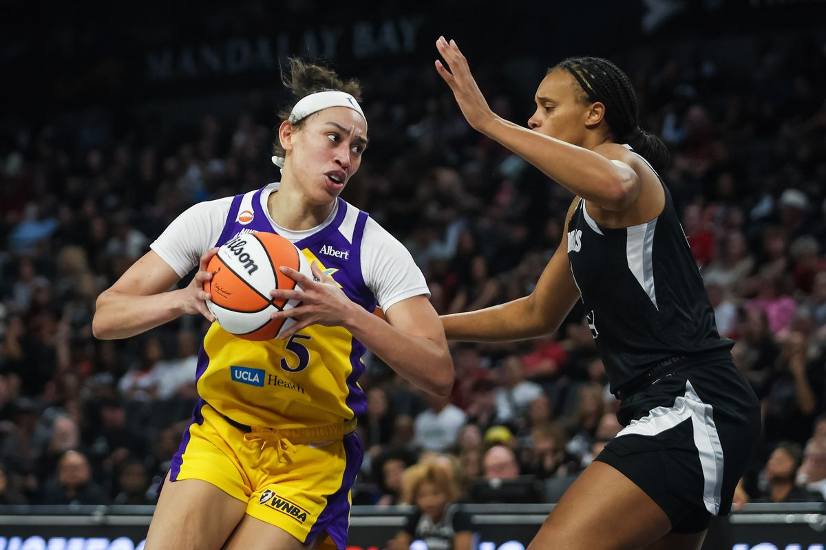 Los Angeles Sparks guard Dearica Hamby (5) does a post move on Las Vegas Aces forward Brianna Turner (21) during a WNBA game between the Las Vegas Aces and the Los Angeles Sparks, Saturday May 23, 2026 in Las Vegas, Nev.