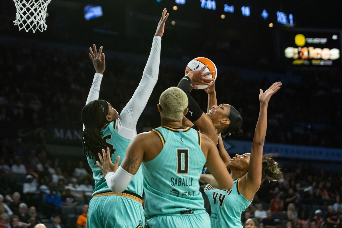 Las Vegas Aces forward A’ja Wilson (22) shoots the ball as New York Liberty players surround her during a WNBA game between the Las Vegas Aces and the New York Liberty, Tuesday June 23, 2026 in Las Vegas, Nev. Las Vegas Aces forward A’ja Wilson (22) shoots the ball as New York Liberty players surround her during a WNBA game between the Las Vegas Aces and the New York Liberty, Tuesday June 23, 2026 in Las Vegas, Nev.