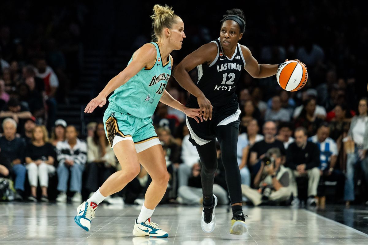 Las Vegas Aces guard Chelsea Gray (12) dribbles the ball upcourt as New York Liberty forward Leonie Fiebich (13) follows her during a WNBA game between the Las Vegas Aces and the New York Liberty, Tuesday June 23, 2026 in Las Vegas, Nev. Las Vegas Aces guard Chelsea Gray (12) dribbles the ball upcourt as New York Liberty forward Leonie Fiebich (13) follows her during a WNBA game between the Las Vegas Aces and the New York Liberty, Tuesday June 23, 2026 in Las Vegas, Nev.