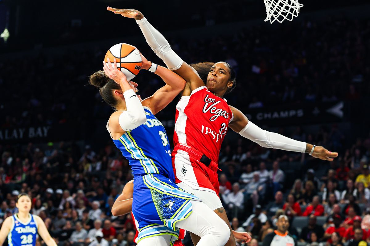 Dallas Wings forward Jessica Shepard (32) is fouled by Las Vegas Aces forward Cheyenne Parker-Tyus (32) on the layup attempt during a WNBA game on Thursday, June 25, 2026, at Michelob ULTRA Arena in Las Vegas, Nevada.