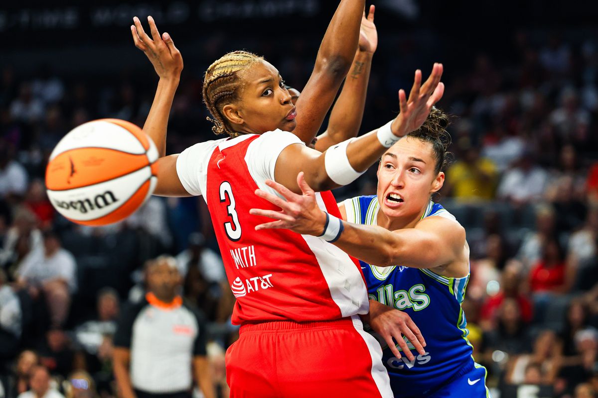 Dallas Wings forward Jessica Shepard (32) passes the ball around Las Vegas Aces forward Nalyssa Smith (3) during a WNBA game on Thursday, June 25, 2026, at Michelob ULTRA Arena in Las Vegas, Nevada.