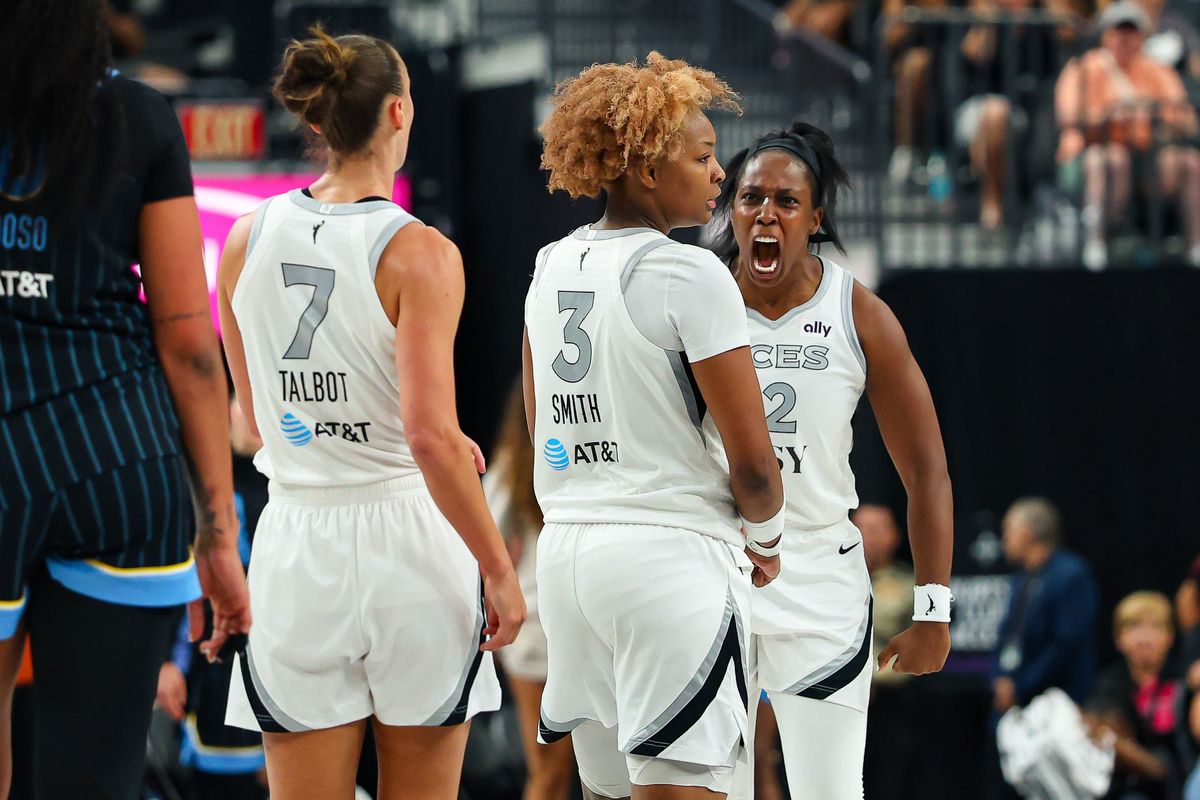 Las Vegas Aces guard Chelsea Gray (12) reacts after a basket scored in overtime by teammate Nalyssa Smith (3) against the Chicago Sky on Friday, July 3, 2026, at T-Mobile Arena in Las Vegas, Nevada.