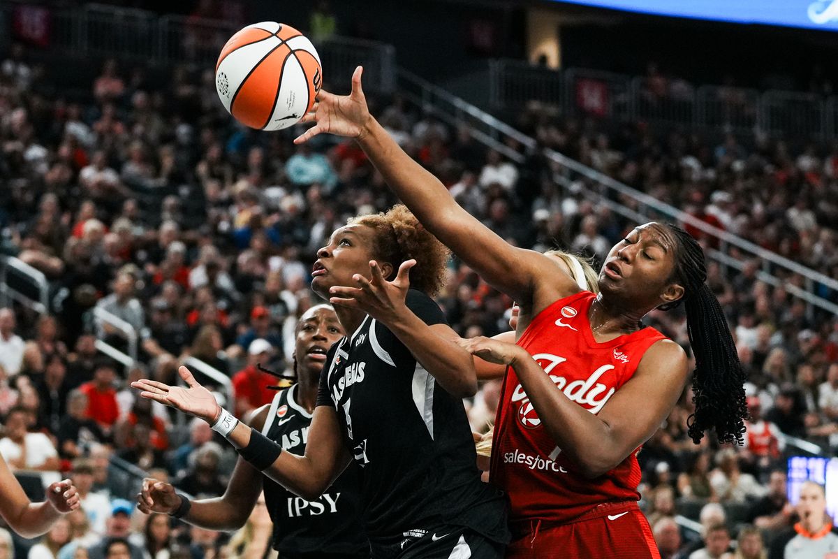 Indiana Fever center Aliyah Boston (7) attempts to rebound a shot from Aces forward Nalyssa Smith (3) during WNBA game against the Las Vegas Aces on Sunday July 5, 2026 at T-Mobile Arena in Las Vegas. Indiana Fever center Aliyah Boston (7) attempts to rebound a shot from Aces forward Nalyssa Smith (3) during WNBA game against the Las Vegas Aces on Sunday July 5, 2026 at T-Mobile Arena in Las Vegas.