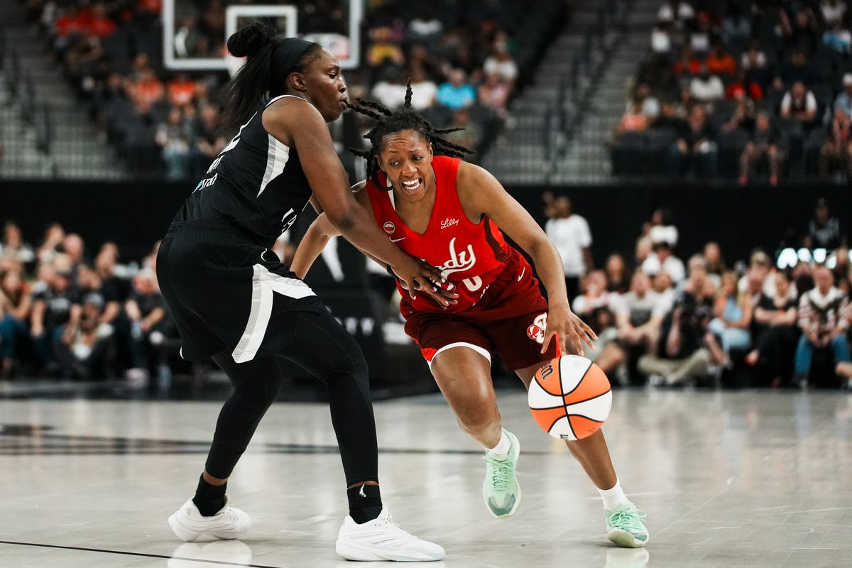 Indiana Fever guard Kelsey Mitchell (0) drives towards the basket while guarded by Aces Chelsea Gray (12) during WNBA game against the Las Vegas Aces on Sunday July 5, 2026 at T-Mobile Arena in Las Vegas. Indiana Fever guard Kelsey Mitchell (0) drives towards the basket while guarded by Aces Chelsea Gray (12) during WNBA game against the Las Vegas Aces on Sunday July 5, 2026 at T-Mobile Arena in Las Vegas.