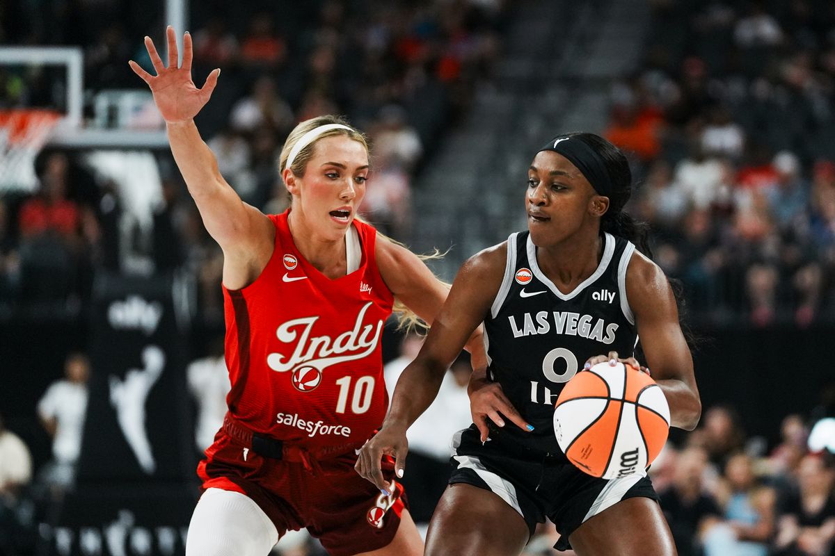 Las Vegas Aces guard Jackie Young (0) takes the ball down the court while guarded by Fever Lexie Hull (10) during WNBA game against Indiana Fever on Sunday July 5, 2026 at T-Mobile Arena in Las Vegas. Las Vegas Aces guard Jackie Young (0) takes the ball down the court while guarded by Fever Lexie Hull (10) during WNBA game against Indiana Fever on Sunday July 5, 2026 at T-Mobile Arena in Las Vegas.