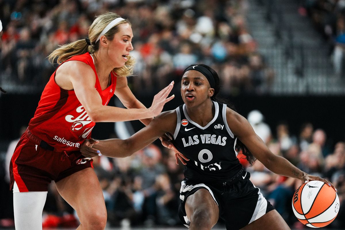 Las Vegas Aces guard Jackie Young (0) takes the ball down the court while guarded by Fever Lexie Hull (10) during WNBA game against Indiana Fever on Sunday July 5, 2026 at T-Mobile Arena in Las Vegas. Las Vegas Aces guard Jackie Young (0) takes the ball down the court while guarded by Fever Lexie Hull (10) during WNBA game against Indiana Fever on Sunday July 5, 2026 at T-Mobile Arena in Las Vegas.