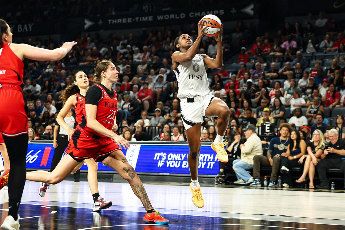 Las Vegas Aces guard Jackie Young (0) drives the basket to score an uncontested lay-up against the Portland Fire on Tuesday, July 28, 2026, at Michelob ULTRA Arena in Las Vegas, Nevada.