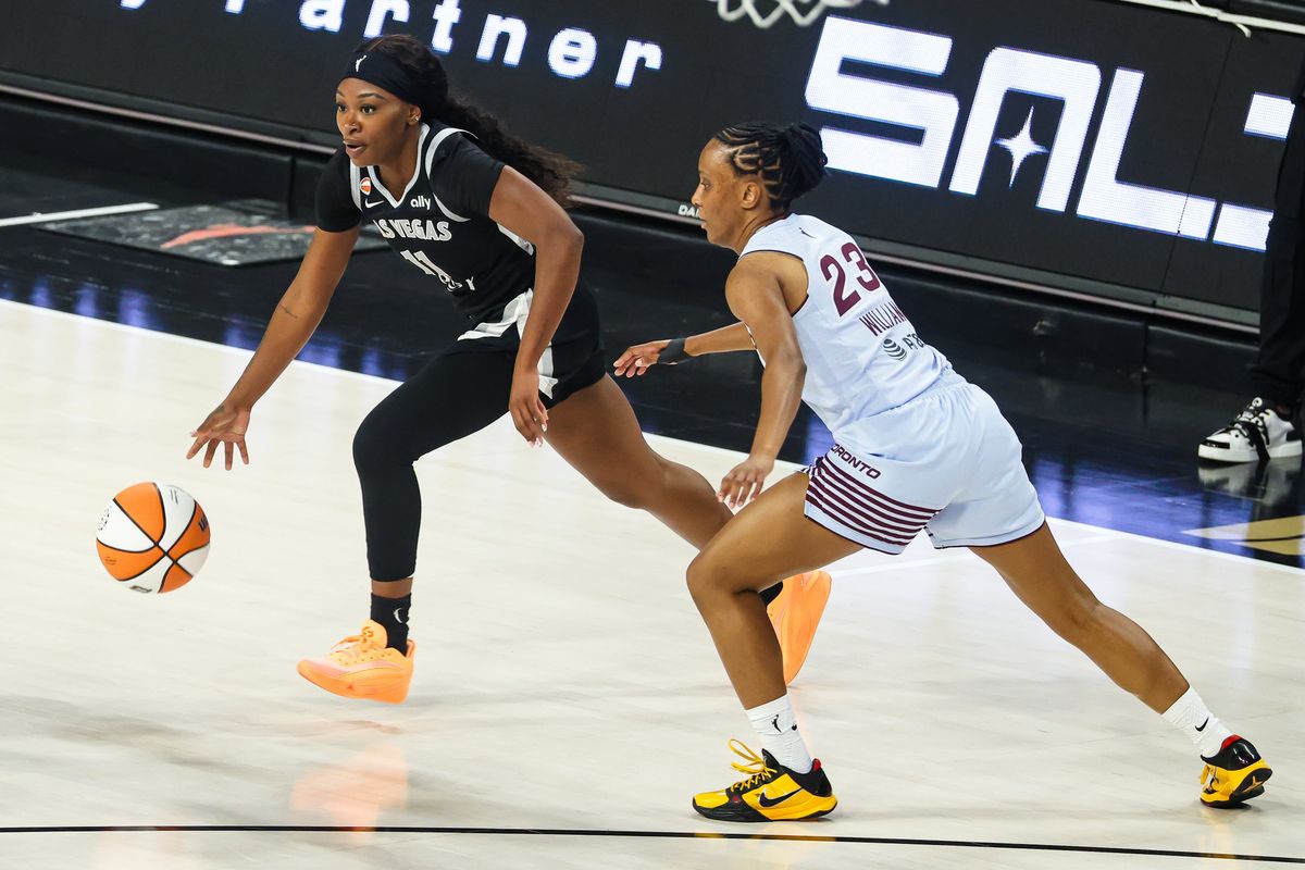 Las Vegas Aces guard Dana Evans (11) runs with the ball guarded by Toronto Tempo guard Kiana Williams (23) during the WNBA game on Friday, August 28, 2026, at Michelob ULTRA Arena in Las Vegas, Nevada. Las Vegas Aces guard Dana Evans (11) runs with the ball guarded by Toronto Tempo guard Kiana Williams (23) during the WNBA game on Friday, August 28, 2026, at Michelob ULTRA Arena in Las Vegas, Nevada.
