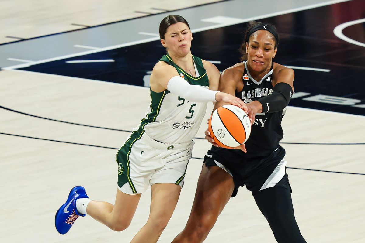Las Vegas Aces center A'ja Wilson (22) recovers a pass contested by Seattle Storm guard Jade Melbourne (5) in the second quarter of the WNBA game on Sunday, September 20, 2026, at Michelob ULTRA Arena in Las Vegas, Nevada. Las Vegas Aces center A'ja Wilson (22) recovers a pass contested by Seattle Storm guard Jade Melbourne (5) in the second quarter of the WNBA game on Sunday, September 20, 2026, at Michelob ULTRA Arena in Las Vegas, Nevada.