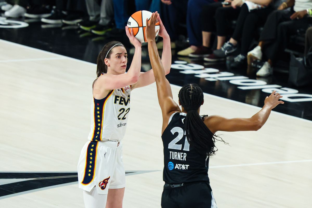 Indiana Fever guard Caitlin Clark (22) shoots a three-point basket guarded by Las Vegas Aces forward/center Brianna Turner (21) in the first quarter of Round 1 Game 1 of the 2026 WNBA Playoffs on Sunday, September 27, 2026, at Michelob ULTRA Arena in Las Vegas, Nevada.