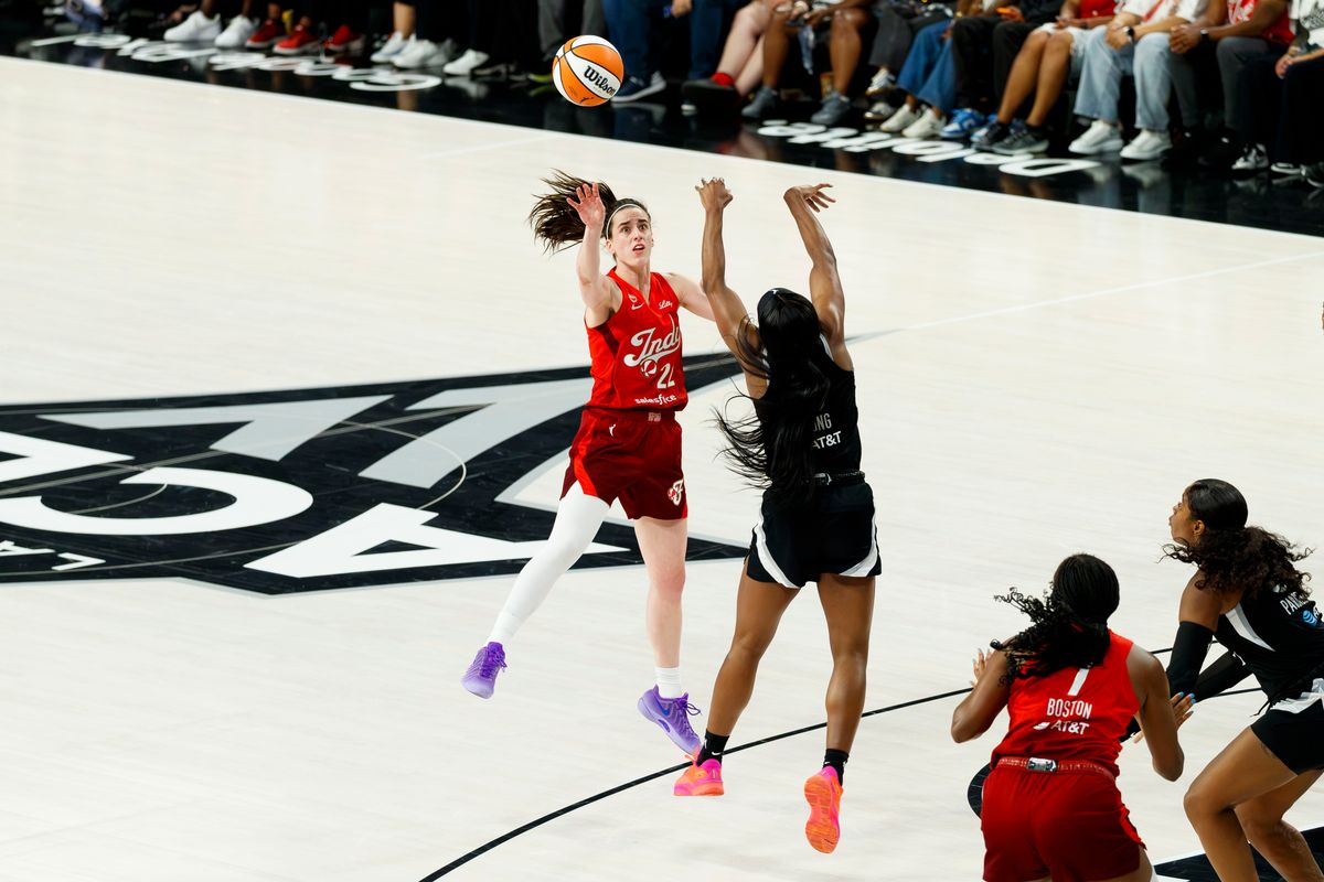 Las Vegas Aces guard Jackie Young blocks a shot from Indiana Fever guard Caitlin Clark during a WNBA Playoff Game on Thursday, October 1, 2026 at Michelob ULTRA Arena in Las Vegas, Nevada.