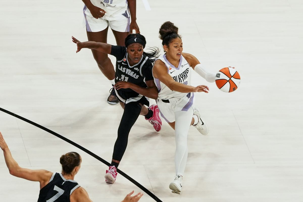 Golden Stake Valkyries guard Veronica Burton (22) passes the ball while guarded by Las Vegas Aces Dana Evans (11) during third quarter of WNBA game against the Las Vegas Aces on Friday October 9, 2026 at Michelob Ultra Arena in Las Vegas. Golden Stake Valkyries guard Veronica Burton (22) passes the ball while guarded by Las Vegas Aces Dana Evans (11) during third quarter of WNBA game against the Las Vegas Aces on Friday October 9, 2026 at Michelob Ultra Arena in Las Vegas.