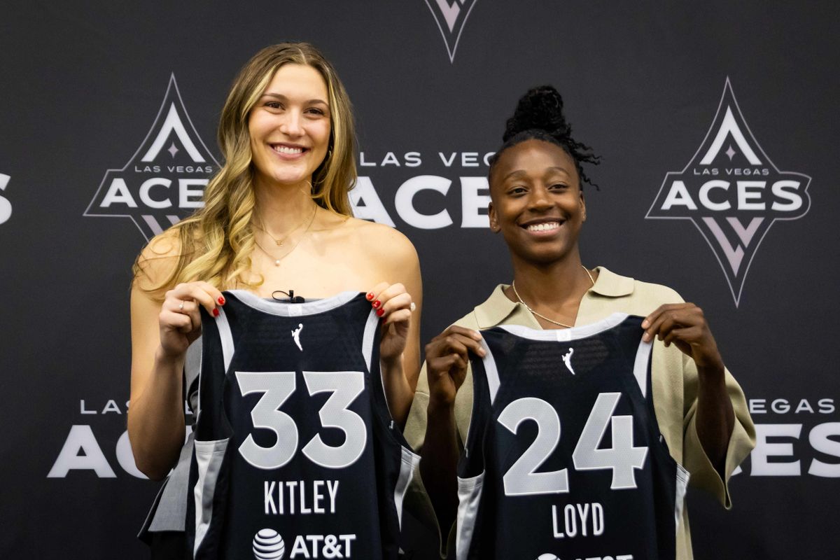 Las Vegas Aces Elizabeth Kitley and Jewell Lloyd pose with Aces jerseys during an introductory press conference, Thursday February 25, 2025 in Las Vegas, Nev.