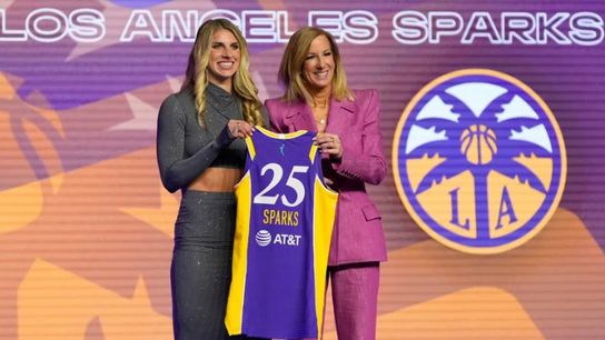 Sarah Ashlee Barker poses with her Sparks jersey alongside WNBA Commissioner Cathy Engelbert during the 2025 WNBA Draft at The Shed in New York City on April 14,2025.