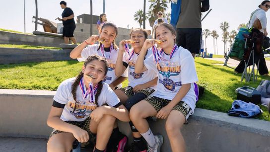 Fresh off their tournament win, the 626ers showcase their medals with pride. 