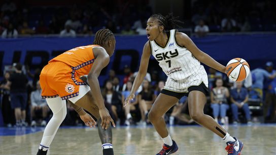 Aug 23, 2025; Chicago, Illinois, USA; Chicago Sky guard Ariel Atkins (7) drives to the basket against Connecticut Sun guard Saniya Rivers (22) during the second half at Wintrust Arena.