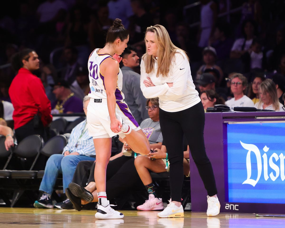 #10 Kelsey Plum of the Los Angeles Sparks speaks with Sparks head coach Lynne Roberts during a pause in action against the Minnesota Lynx on July 10, 2025 in Los Angeles, CA. #10 Kelsey Plum of the Los Angeles Sparks speaks with Sparks head coach Lynne Roberts during a pause in action against the Minnesota Lynx on July 10, 2025 in Los Angeles, CA.