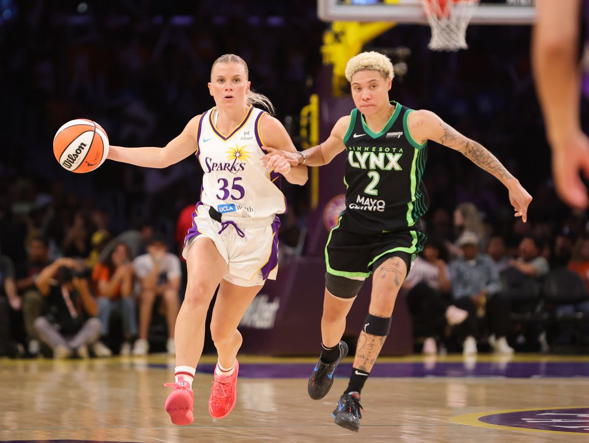#35 Julie Vanloo of the Los Angeles Sparks dribbles the ball up court against the Minnesota Lynx on July 10, 2025 in Los Angeles, CA. #35 Julie Vanloo of the Los Angeles Sparks dribbles the ball up court against the Minnesota Lynx on July 10, 2025 in Los Angeles, CA.