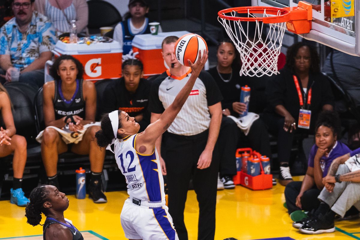 LA Sparks guard Rae Burrell (12),  taking a lay-up at a WNBA basketball game against the Connecticut Suns, Sunday July 13th, 2025 in Los Angeles, California. 