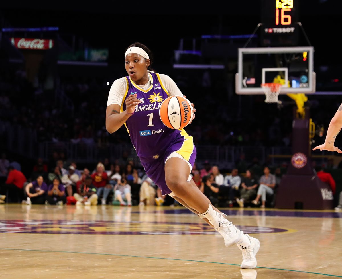 #1 Sania Feagin drives the lane against the Washington Mystics on July 15, 2025 in Los Angeles, CA.