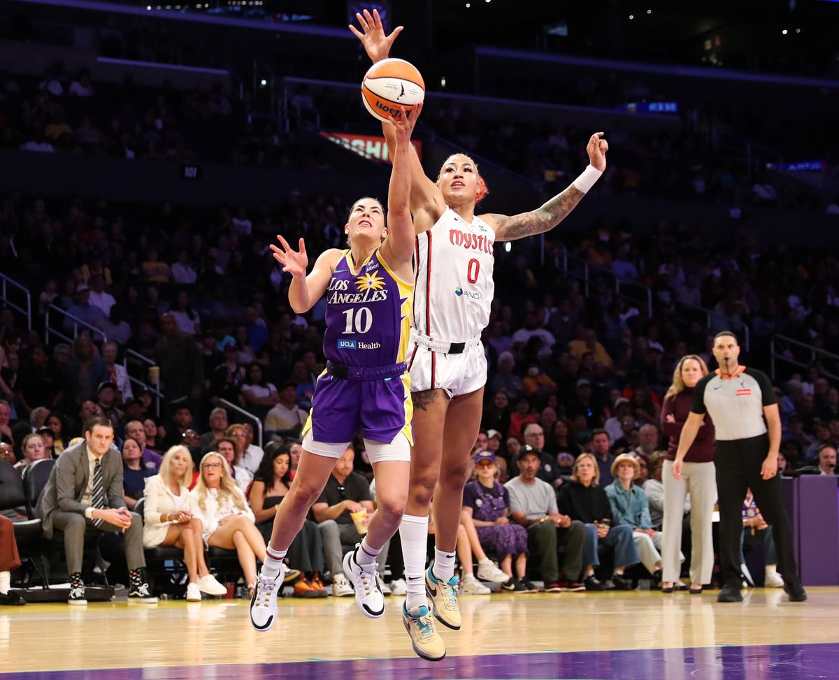 #10 Kelsey Plum of the Los Angeles Sparks attempts a layup against the Washington Mystics on July 15, 2025 in Los Angeles, CA.