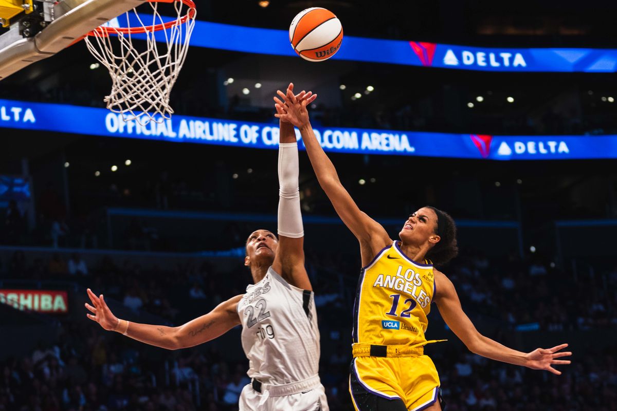 LA Sparks forward Rae Burrell (12), gets fouled on the lay-up at a WNBA basketball game against the Las Vegas Aces, Tuesday July 29th, 2025 in Los Angeles, California.