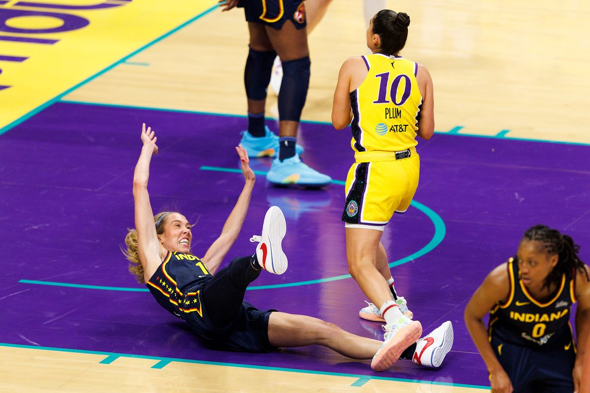 Lexie Hull #10 of the Indiana Fever falls down against Kelsey Plum #10 of the Los Angeles Sparks during the game at Crypto.com Arena on August 5, 2025 in Los Angeles, California. Lexie Hull #10 of the Indiana Fever falls down against Kelsey Plum #10 of the Los Angeles Sparks during the game at Crypto.com Arena on August 5, 2025 in Los Angeles, California.