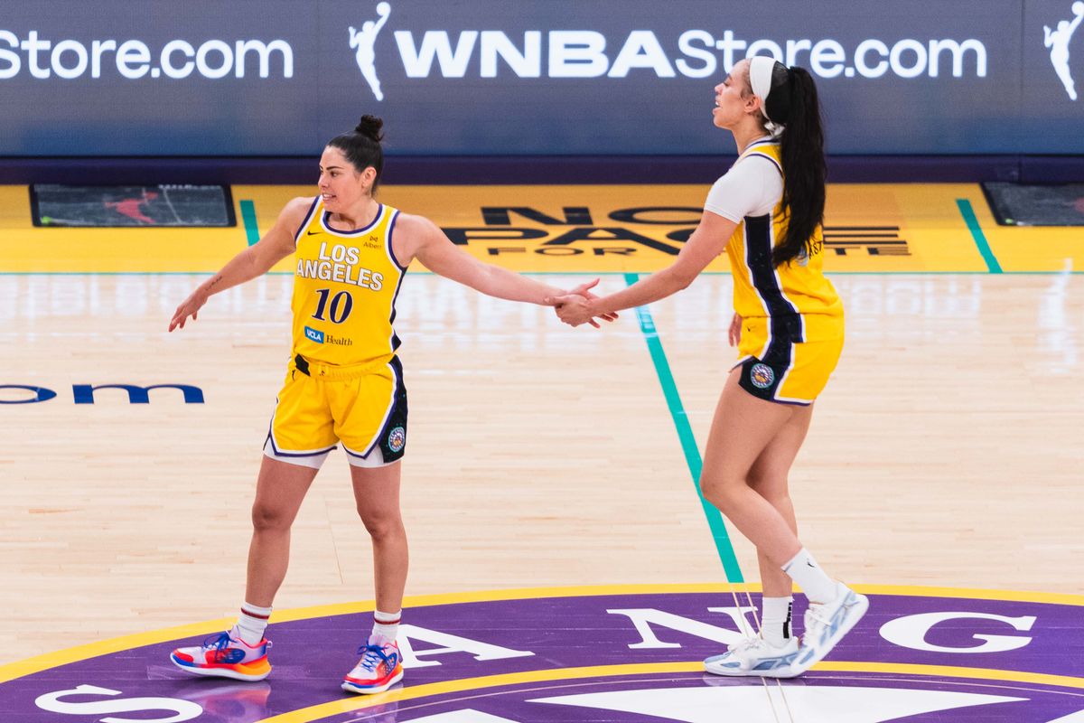 LA Sparks forward Dearica Hamby (5), high-fives guard Kelsey Plum (10) at a WNBA basketball game against the Indiana Fever, Friday August 29th, 2025 in Los Angeles, California. 