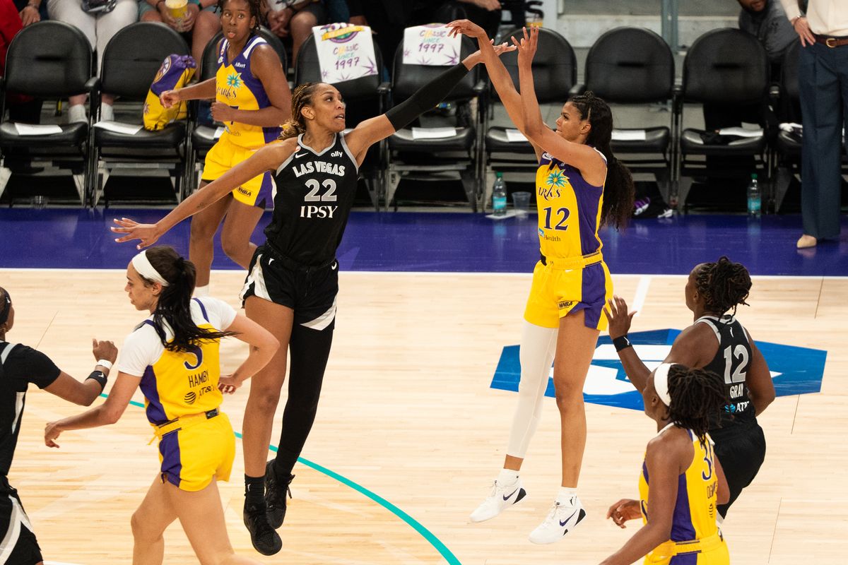 LA Sparks guard Rae Burrell (12) shoots a contested three during a WNBA basketball game against the Las Vegas Aces, Sunday May 10th, 2026 in Los Angeles, California. LA Sparks guard Rae Burrell (12) shoots a contested three during a WNBA basketball game against the Las Vegas Aces, Sunday May 10th, 2026 in Los Angeles, California.