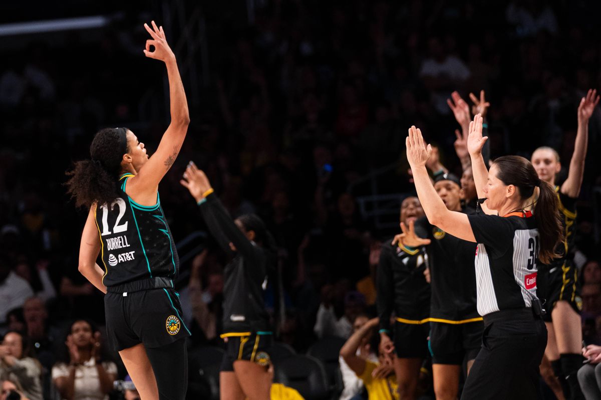 LA Sparks guard Rae Burrel (12) celebrates a made three-pointer at a WNBA basketball game against the Las Vegas Aces, Tuesday June 2nd, 2026 in Los Angeles, California.