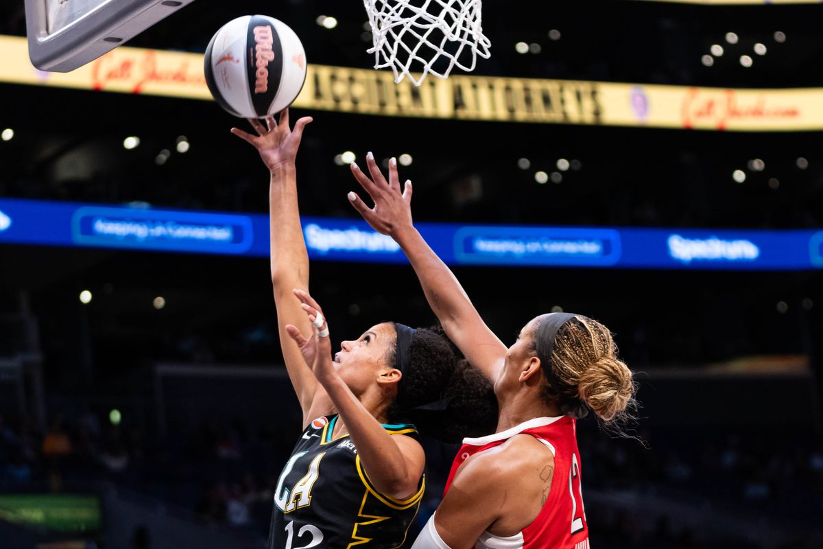 LA Sparks guard Rae Burrel (12) attacks the basket at a WNBA basketball game against the Las Vegas Aces, Tuesday June 2nd, 2026 in Los Angeles, California. 