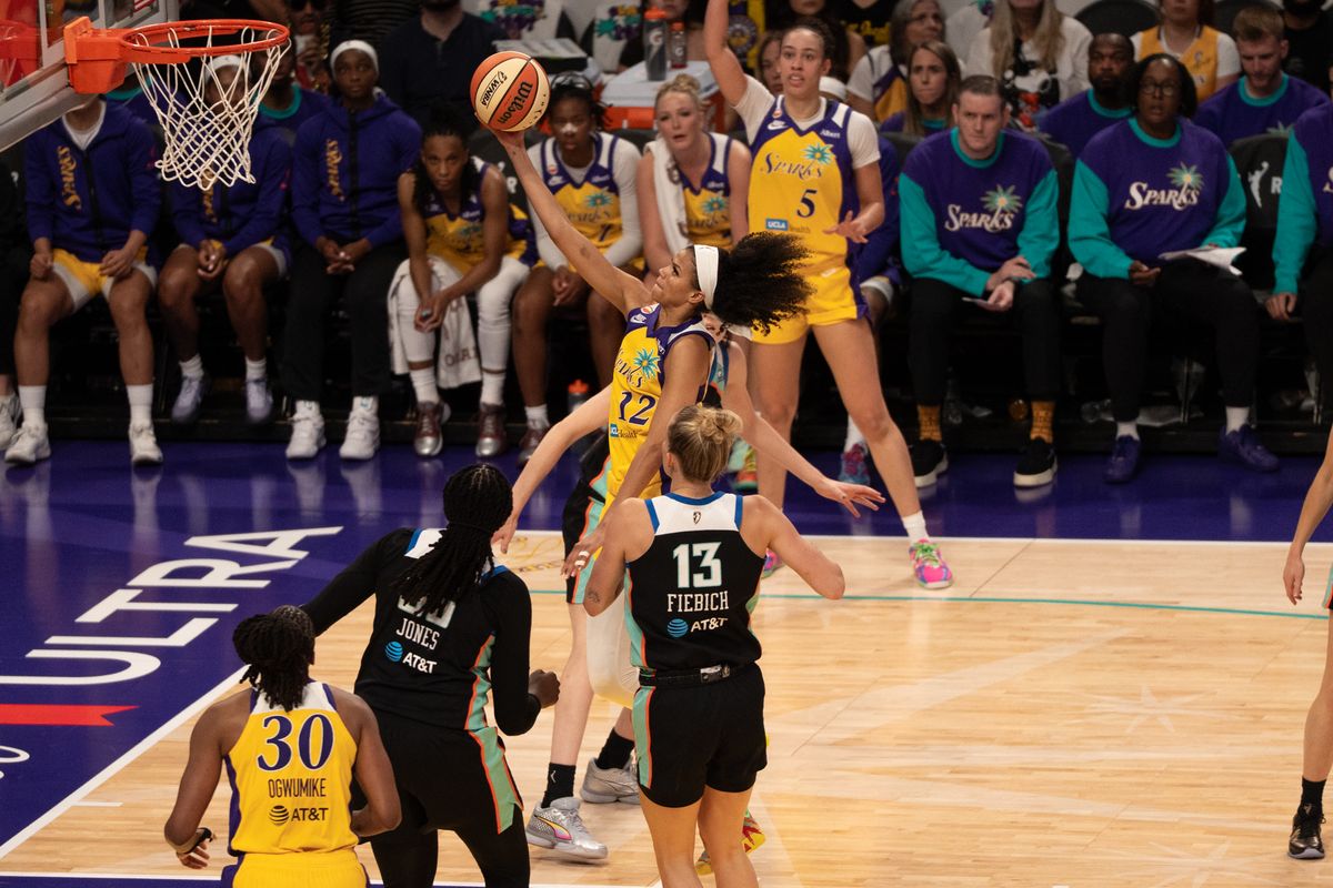 Los Angeles Sparks Guard Rae Burrell (12) floats past her defender on her way to score two points during a WNBA game against the New York Liberty, Sunday June 21st, 2026 in Los Angeles, California. Los Angeles Sparks Guard Rae Burrell (12) floats past her defender on her way to score two points during a WNBA game against the New York Liberty, Sunday June 21st, 2026 in Los Angeles, California.