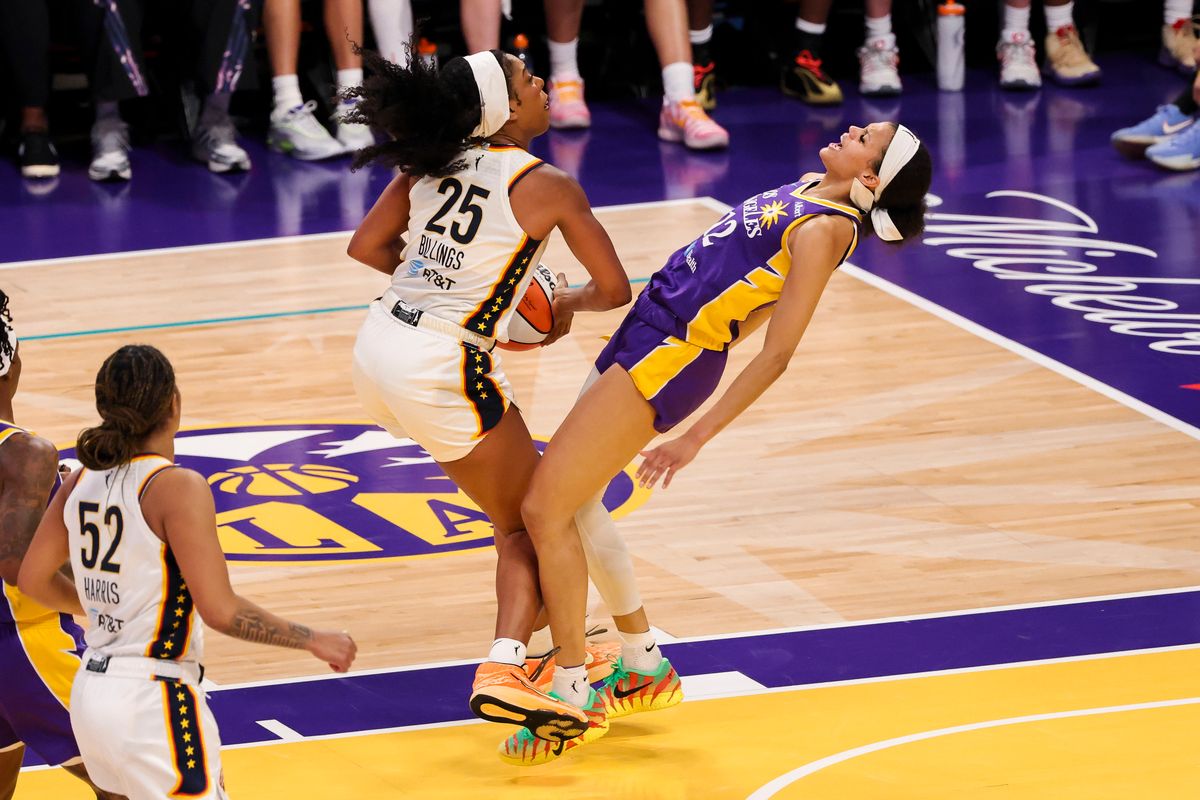 Rae Burrell #12 of the Los Angeles Sparks draws a charge on Monique Billings #25 of the Indiana Fever during a WNBA game, Wednesday July 8, 2026 in Los Angeles, Calif. Rae Burrell #12 of the Los Angeles Sparks draws a charge on Monique Billings #25 of the Indiana Fever during a WNBA game, Wednesday July 8, 2026 in Los Angeles, Calif.