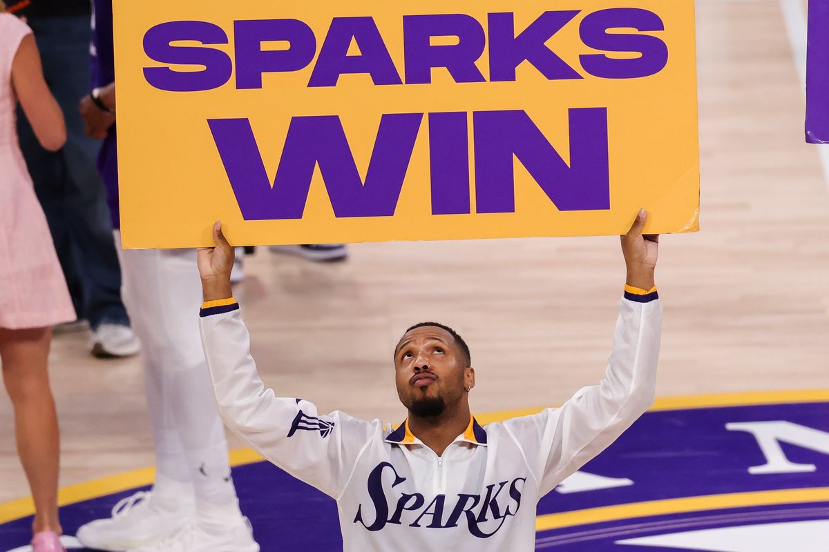 A member of the Sparks Crew holds up a “Sparks Win” sign after a WNBA game against the Indiana Fever, Wednesday July 8, 2026 in Inglewood, Calif. A member of the Sparks Crew holds up a “Sparks Win” sign after a WNBA game against the Indiana Fever, Wednesday July 8, 2026 in Inglewood, Calif.