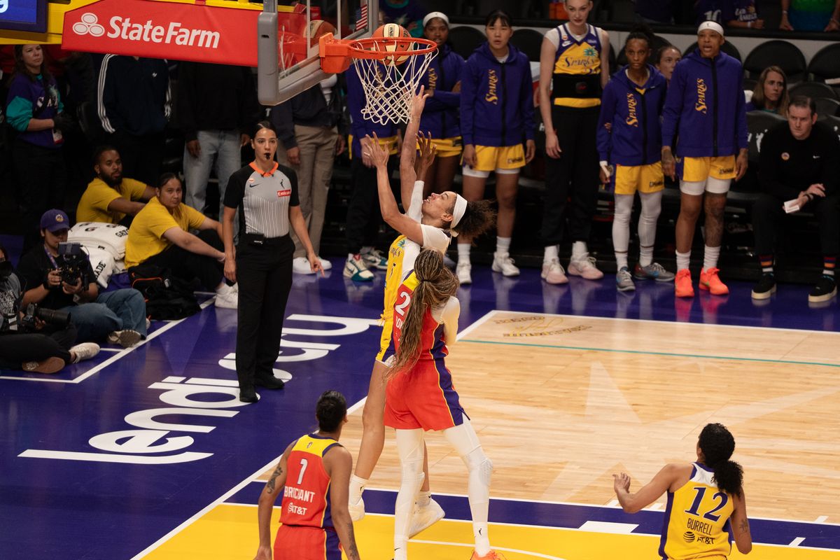 Los Angeles Sparks Forward Dearica Hamby (5) attacks the rim and scores a contested layup during a WNBA game against the Phoenix Mercury, Wednesday July 22nd, 2026 in Los Angeles, California.
