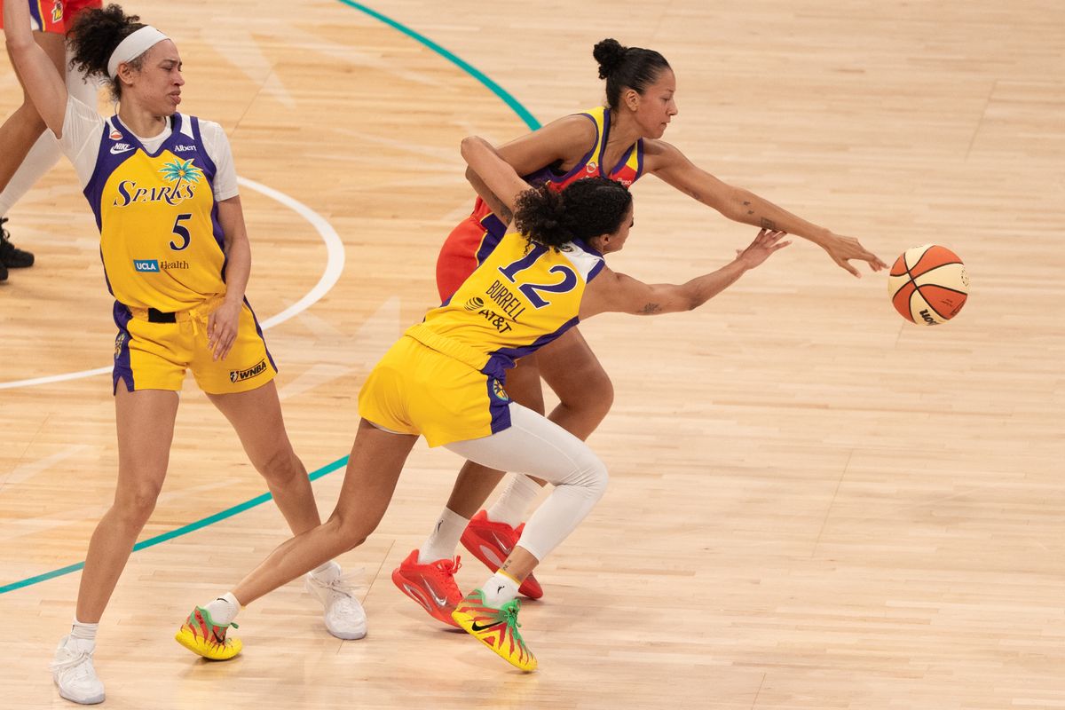 Los Angeles Sparks Guard Rae Burrell (12) fights for a loose ball during a WNBA game against the Phoenix Mercury, Wednesday July 22nd, 2026 in Los Angeles, California.