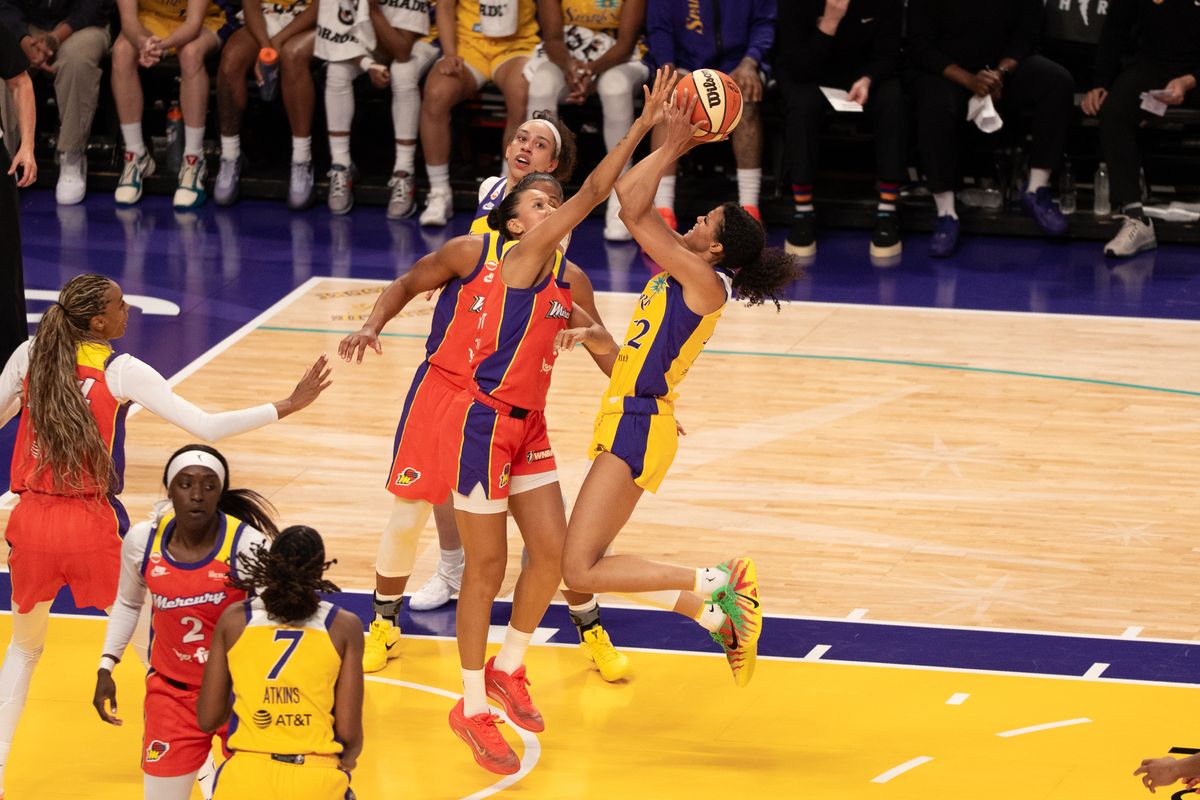 Los Angeles Sparks Guard Rae Burrell (12) attacks the rim on a fast break and scores a pull up jumper during a WNBA game against the Phoenix Mercury, Wednesday July 22nd, 2026 in Los Angeles, California.