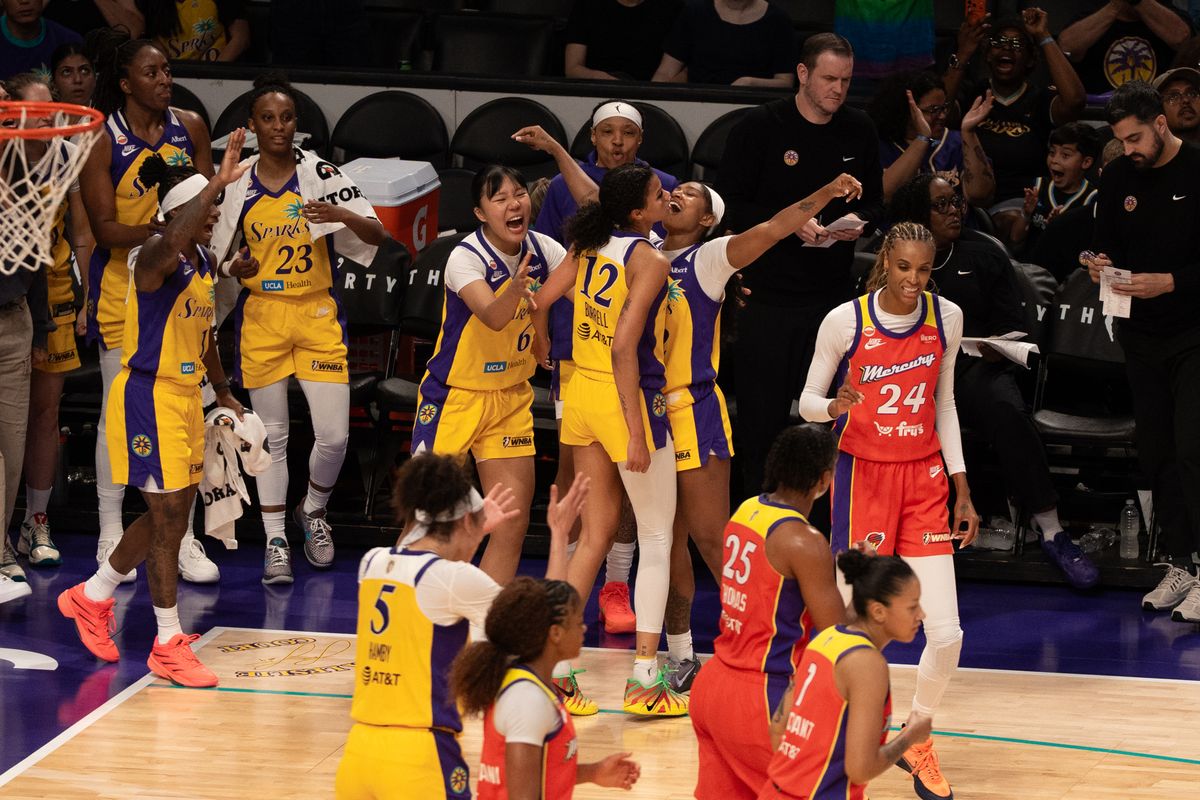 Los Angeles Sparks bench celebrate a buzzer beater before halftime during a WNBA game against the Phoenix Mercury, Wednesday July 22nd, 2026 in Los Angeles, California.